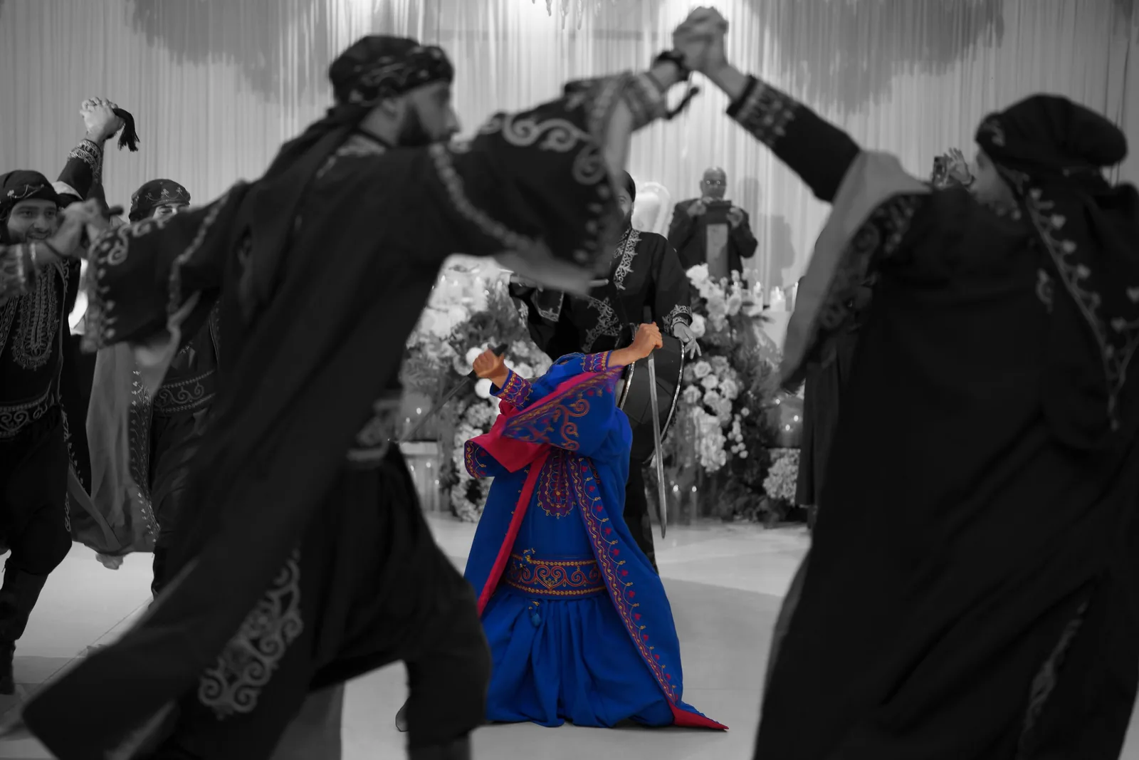 Wedding celebration with guests dancing and enjoying festivities on the dance floor.