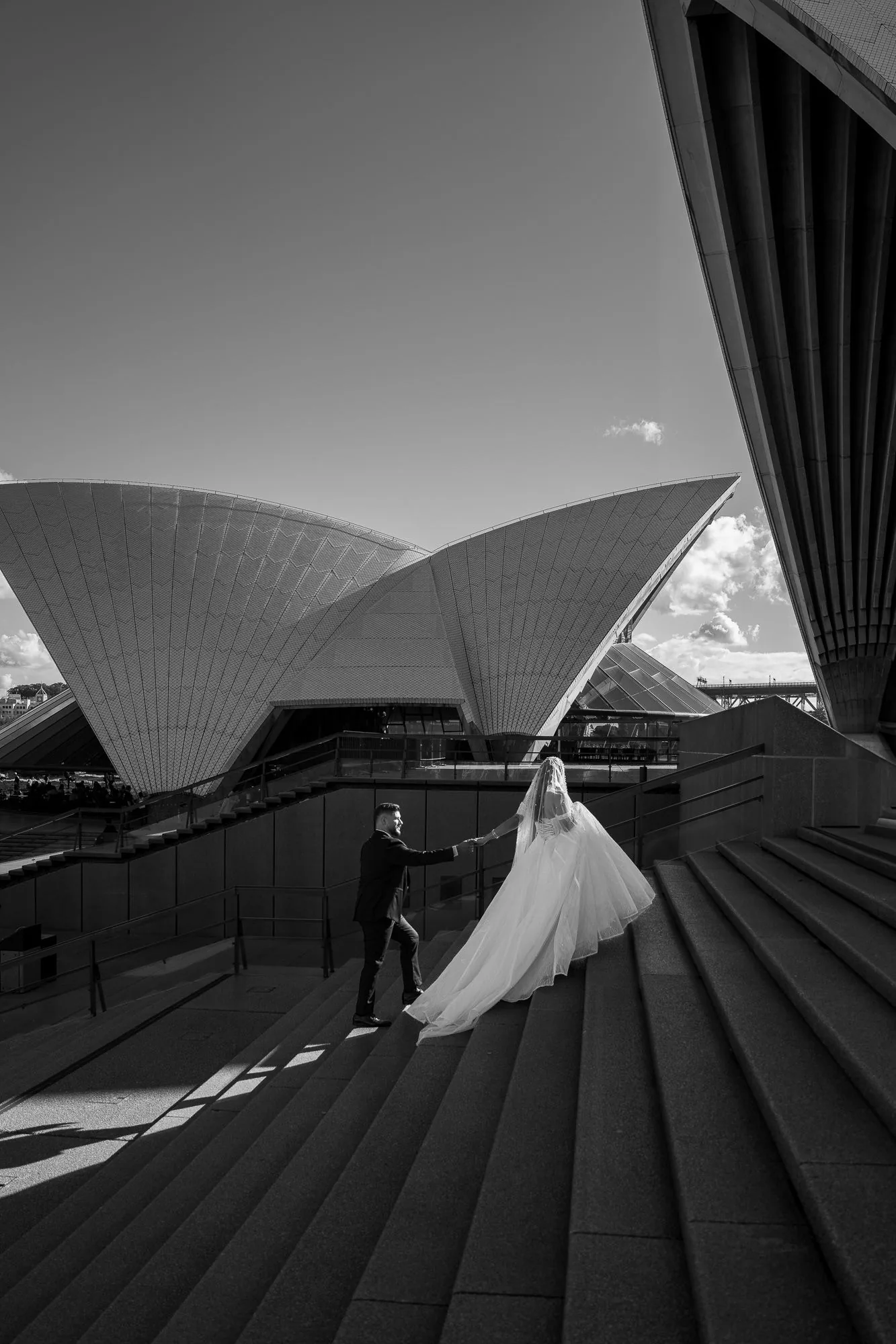 Couple climbing the Sydney Opera House steps