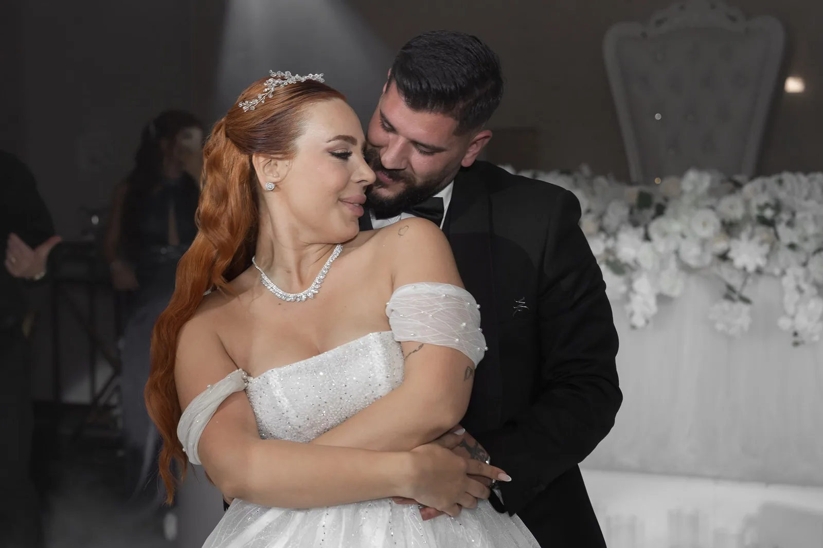 Intimate dance moment captured between newlyweds at their reception celebration.